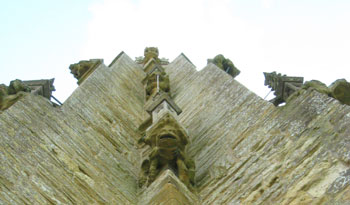 gargoyles on the tower of st marys, beaminster, dorset